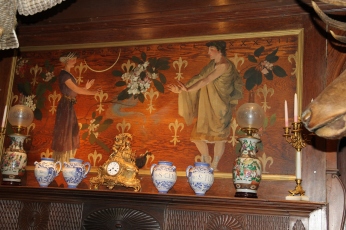 Mounted above the fireplace, this painting, a housewarming present, represents the French and Pennsylvanian connections of the Pinchot Family through the Fleur-de-lis and the Rhododendron.