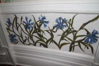 Flowers painted on the wall in the office.